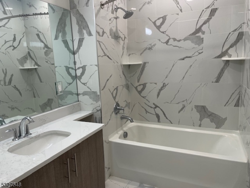 205 Stuyvesant Avenue, Unit 203 Lyndhurst, NJ 07071 - Photo 10 of 14 a bathroom with a sink and a bathtub