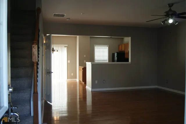 wooden floor in a hall with a mirror
