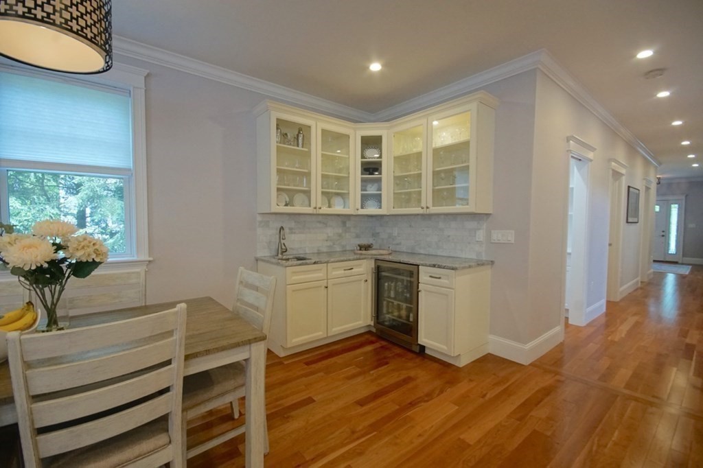 13 Warren Street Needham, MA 02492 - Photo 15 of 34 a kitchen with a sink cabinets and wooden floor
