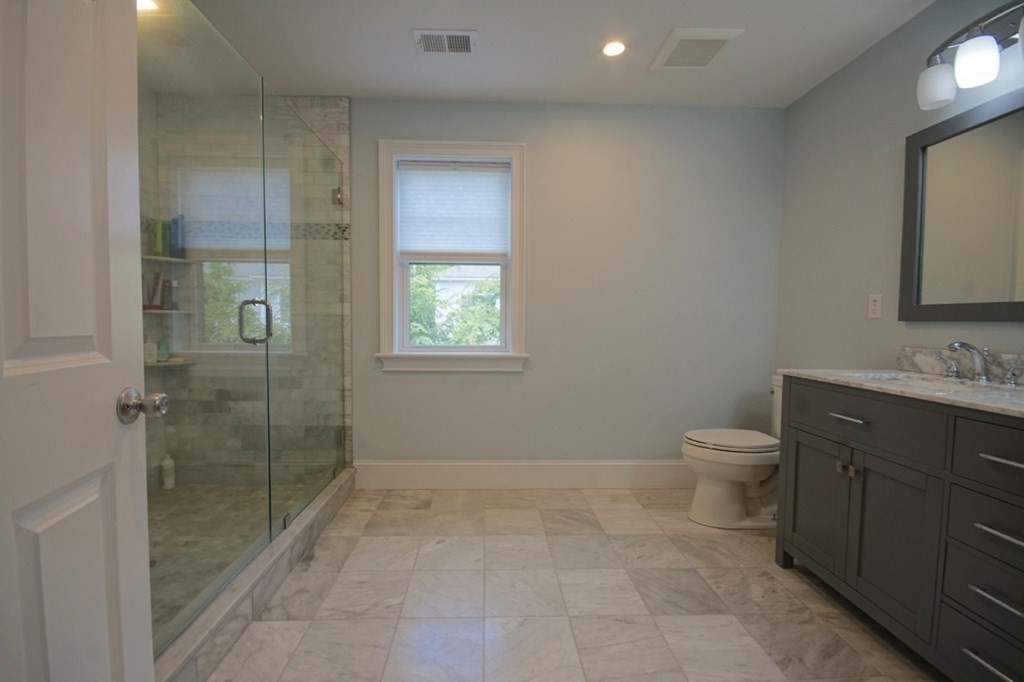 13 Warren Street Needham, MA 02492 - Photo 23 of 34 a bathroom with a toilet sink and shower