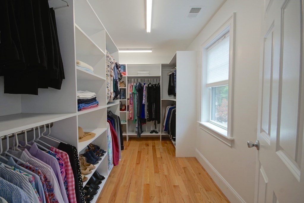 13 Warren Street Needham, MA 02492 - Photo 24 of 34 a view of walk in closet with clothes and shoes