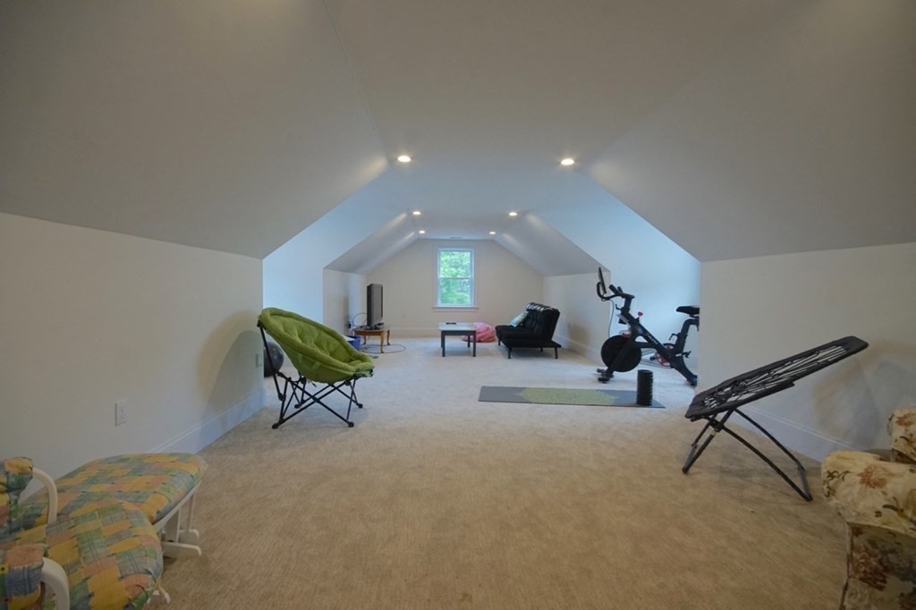 13 Warren Street Needham, MA 02492 - Photo 27 of 34 a living room with furniture and a rug
