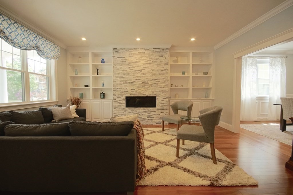 13 Warren Street Needham, MA 02492 - Photo 4 of 34 a living room with furniture and a fireplace
