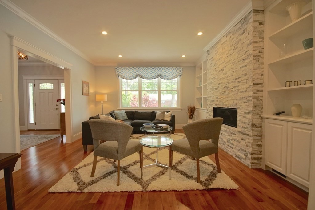13 Warren Street Needham, MA 02492 - Photo 5 of 34 a living room with furniture and a fireplace