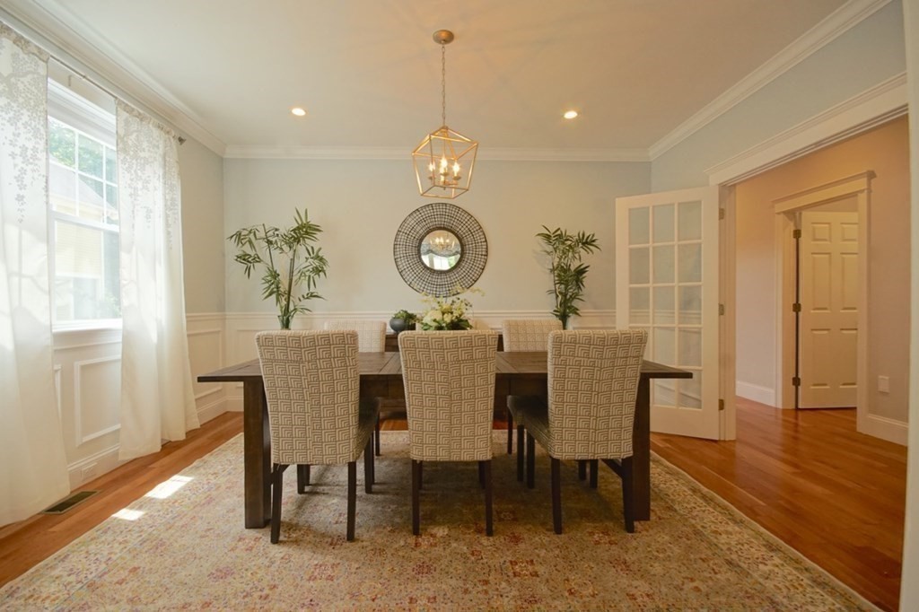 13 Warren Street Needham, MA 02492 - Photo 7 of 34 a view of a dining room with furniture window and wooden floor