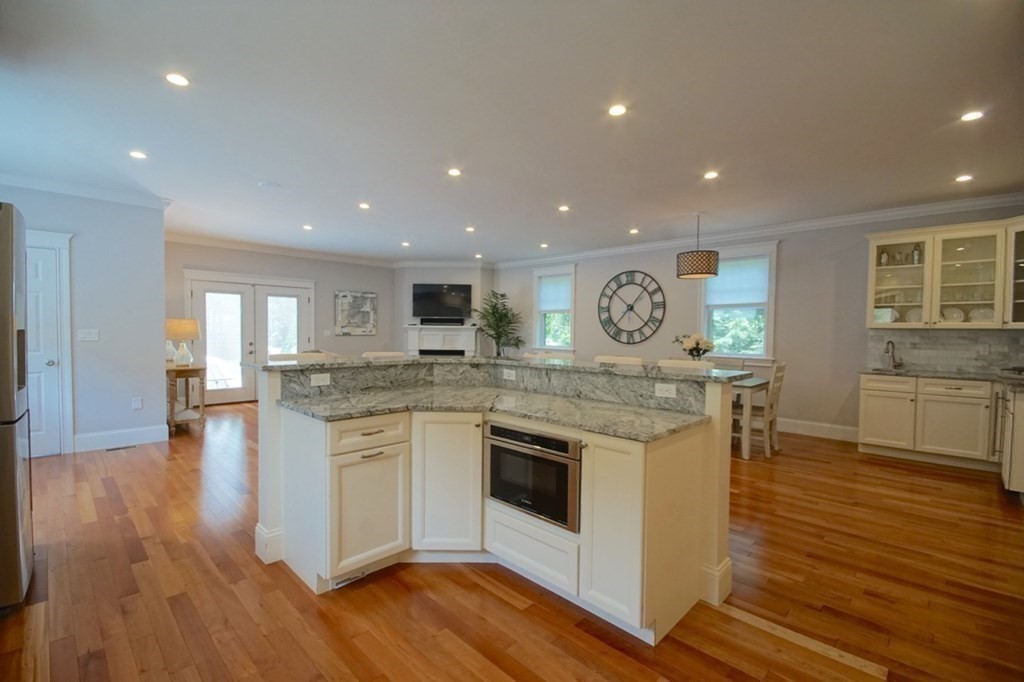 13 Warren Street Needham, MA 02492 - Photo 9 of 34 a open kitchen with stove and wooden floor