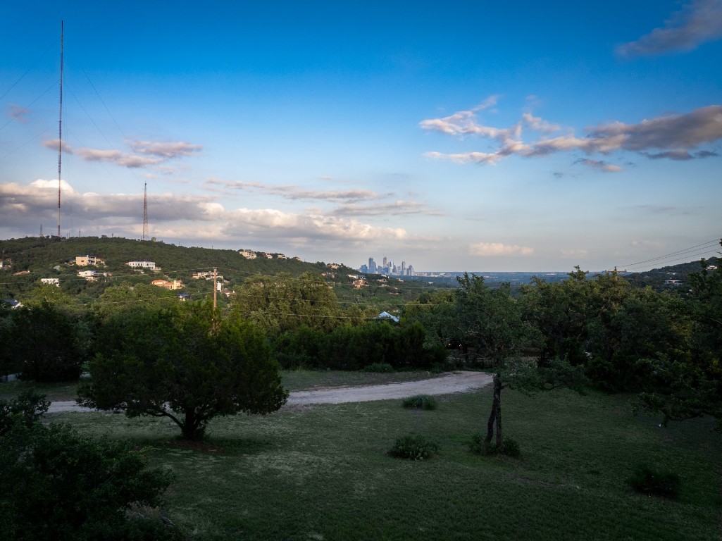 1106 The High Road Austin, TX 78746 - Photo 2 of 20 View from site must be seen to be appreciated - DT Austin skyline beautifully framed between the green hills.
