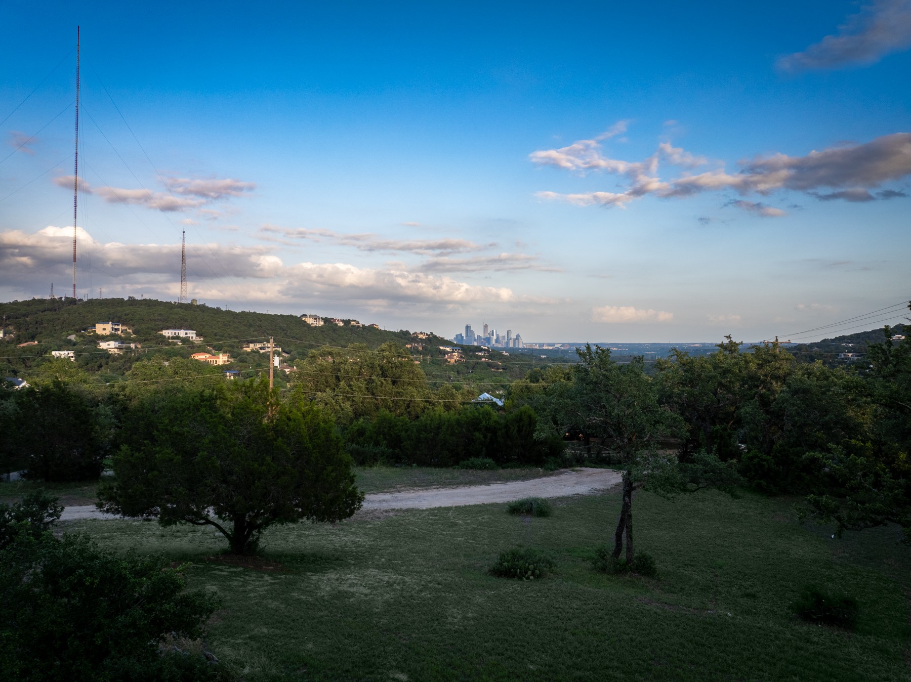1106 The High Road Austin, TX 78746 - Photo 2 of 20 View from site must be seen to be appreciated - DT Austin skyline beautifully framed between the green hills.