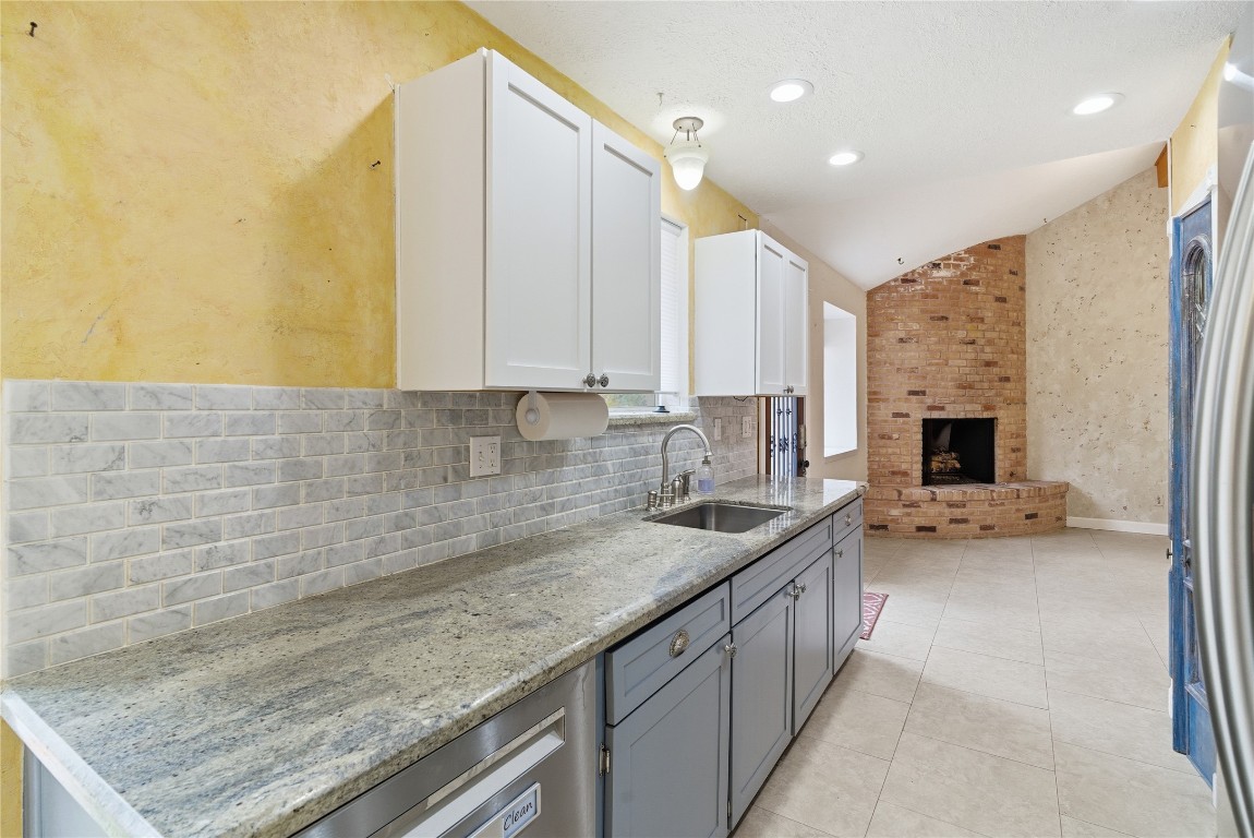 2003 Richvale Lane Houston, TX 77062 - Photo 13 of 29 a kitchen with a sink and a stove top oven