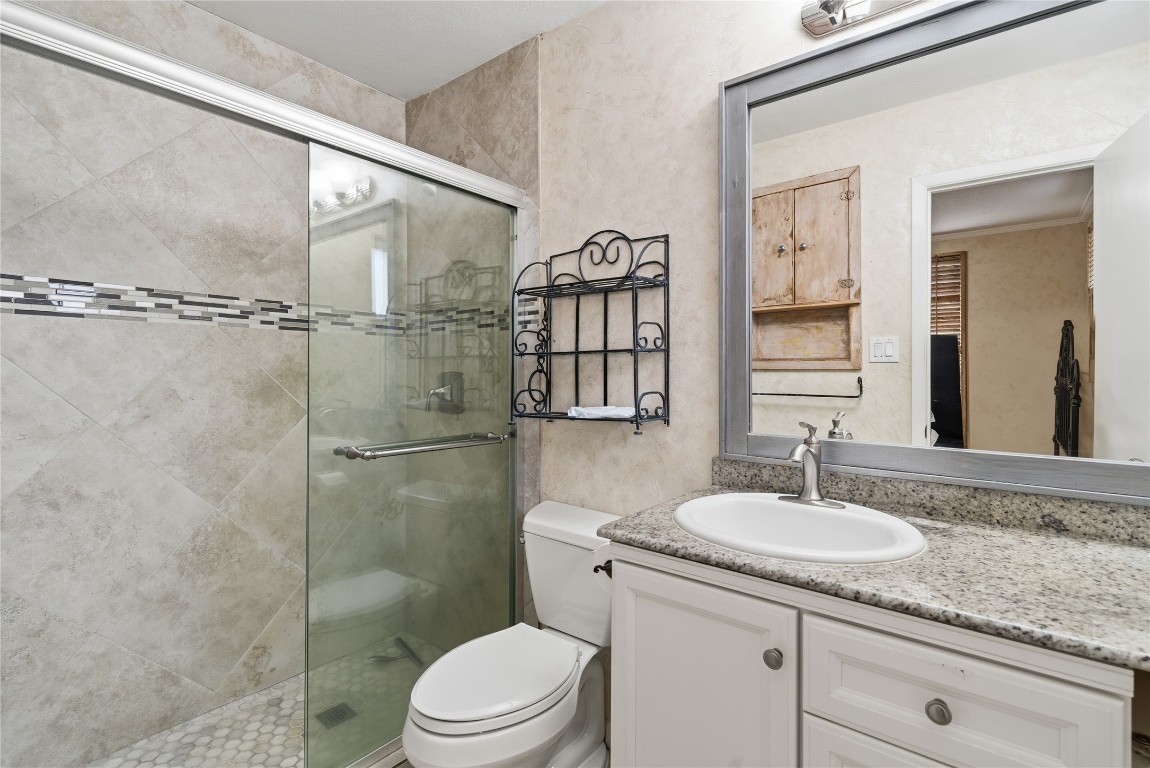 2003 Richvale Lane Houston, TX 77062 - Photo 19 of 29 a bathroom with a sink toilet and shower