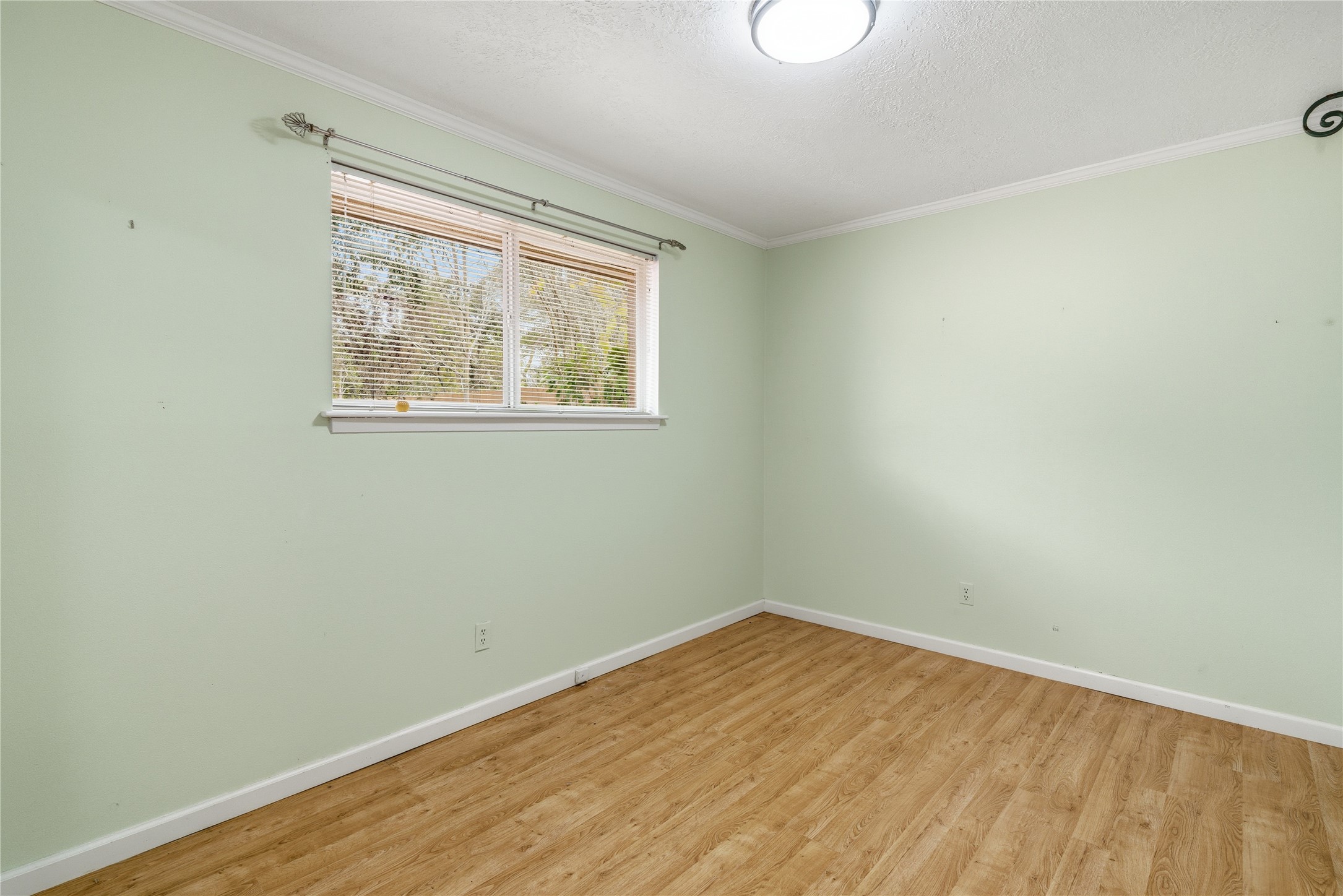 2003 Richvale Lane Houston, TX 77062 - Photo 20 of 29 an empty room with wooden floor and windows