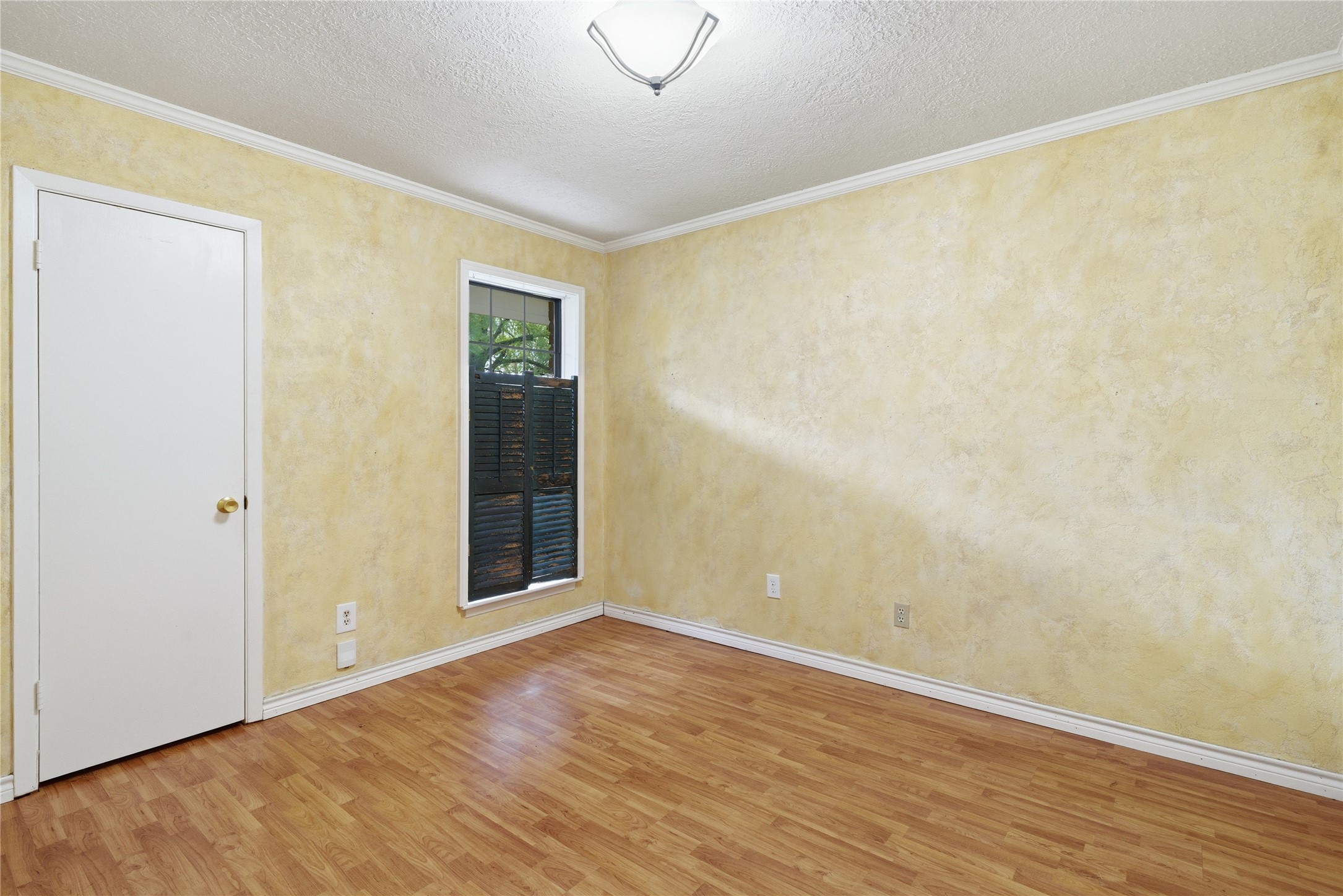 2003 Richvale Lane Houston, TX 77062 - Photo 22 of 29 a view of an empty room with wooden floor and a window
