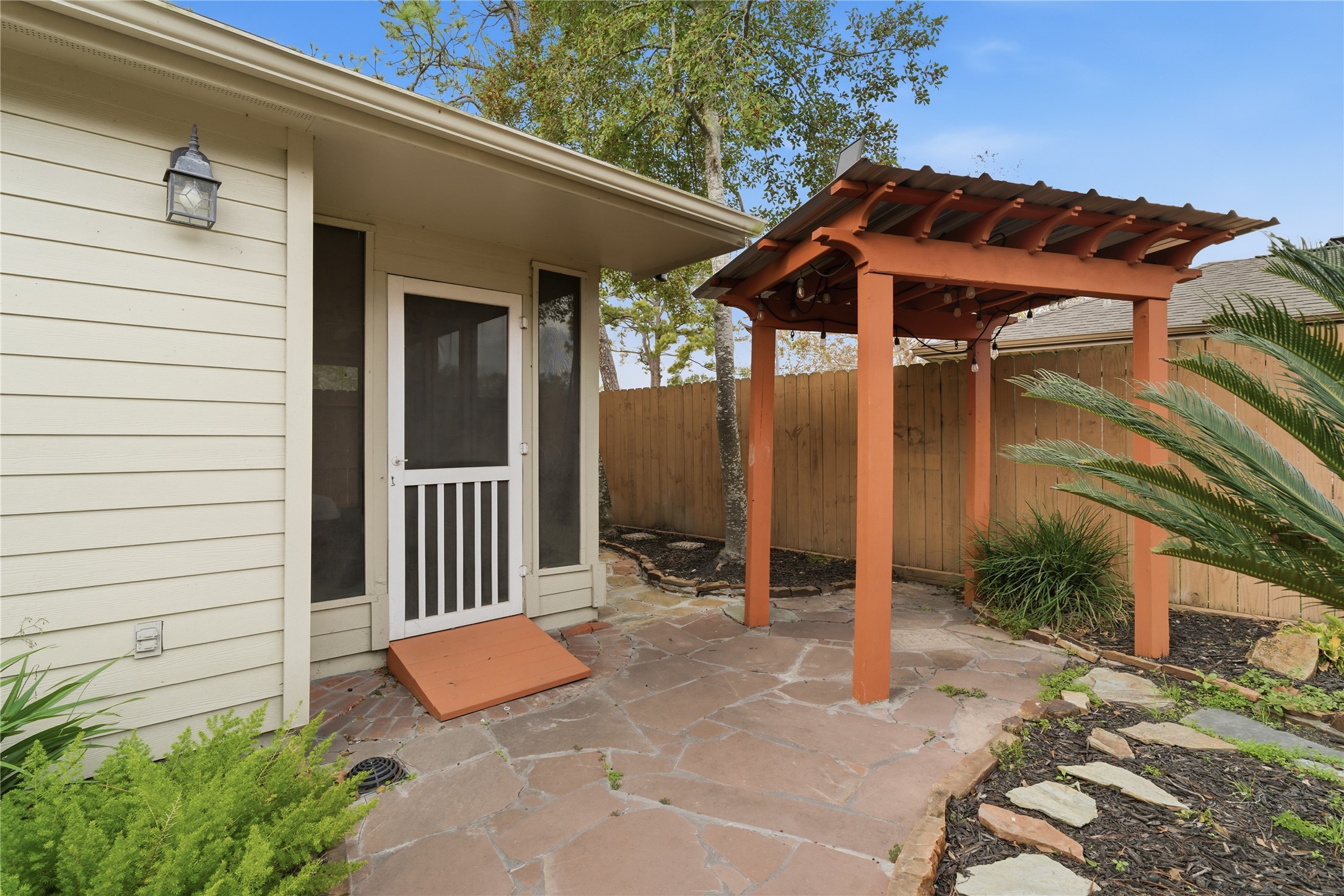 2003 Richvale Lane Houston, TX 77062 - Photo 27 of 29 a backyard of a house with barbeque oven table and chairs