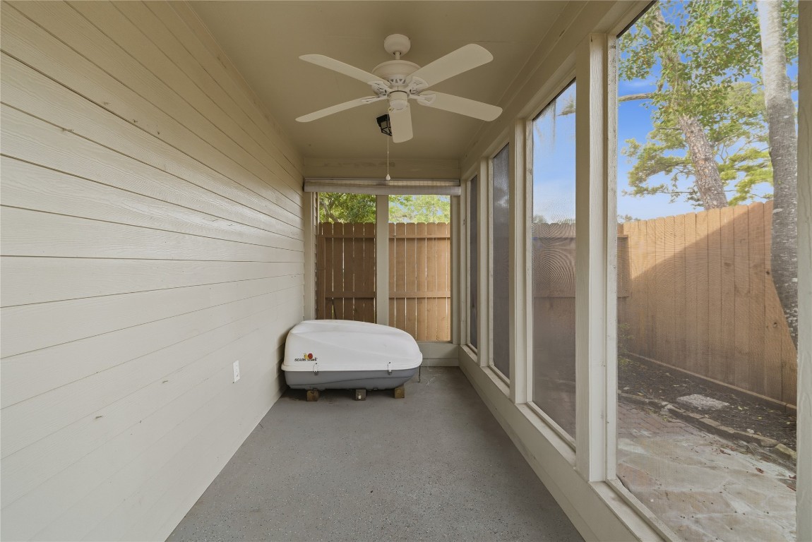 2003 Richvale Lane Houston, TX 77062 - Photo 28 of 29 a view of a bedroom with a large window and chandelier