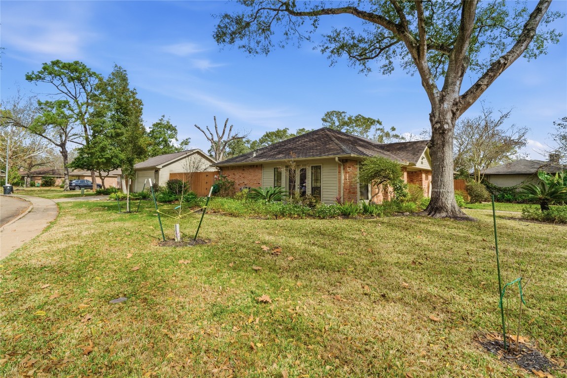 2003 Richvale Lane Houston, TX 77062 - Photo 3 of 29 a view of a house with a yard