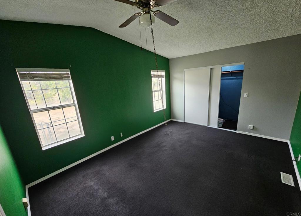 26455 Paradise Valley Road, Unit 62 Warner Springs, CA 92086 - Photo 17 of 19 a view of an empty room with a window and a kitchen