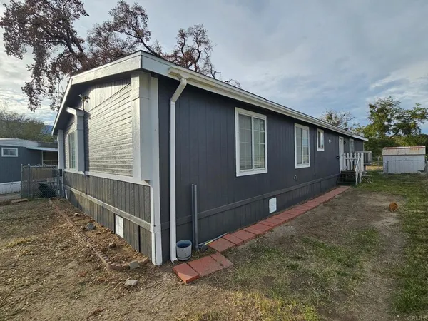 a house with trees in the background