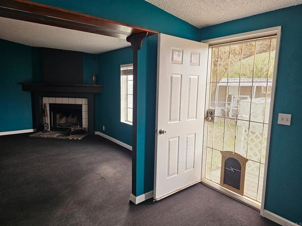 26455 Paradise Valley Road, Unit 62 Warner Springs, CA 92086 - Photo 5 of 19 a view of an empty room with a fireplace