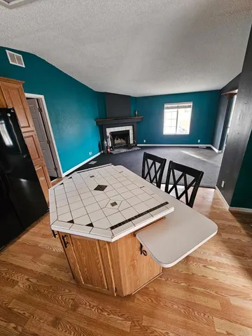 a view of kitchen with furniture and window