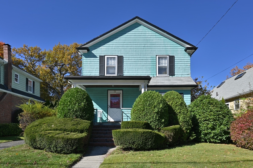 73 Woodard Road Boston, MA 02132 - Photo 1 of 20 a front view of a house with a yard