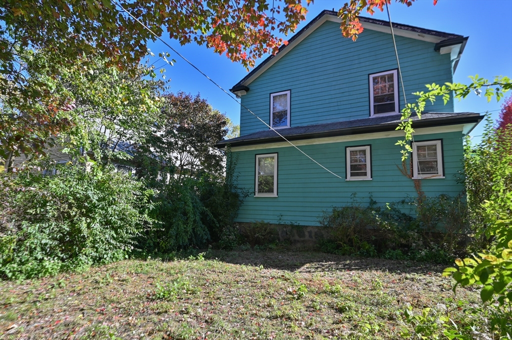 73 Woodard Road Boston, MA 02132 - Photo 14 of 20 a view of a house with a yard