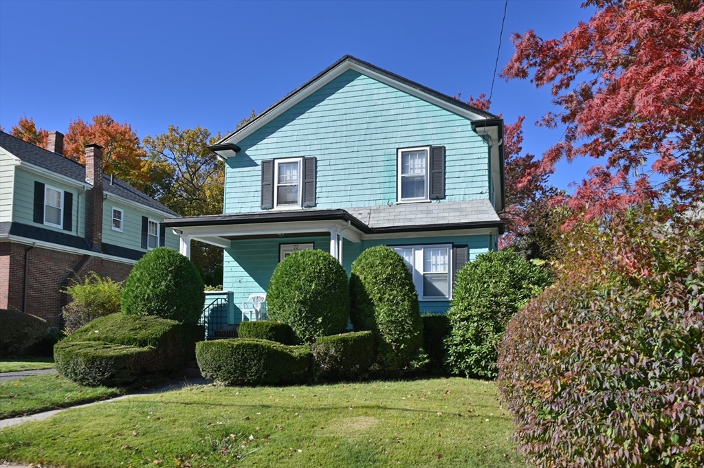 73 Woodard Road Boston, MA 02132 - Photo 16 of 20 a view of a house with a yard