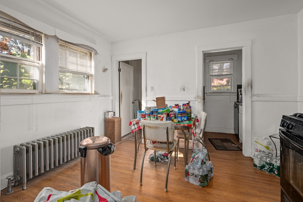 73 Woodard Road Boston, MA 02132 - Photo 2 of 20 a view of a dining room with furniture window and wooden floor