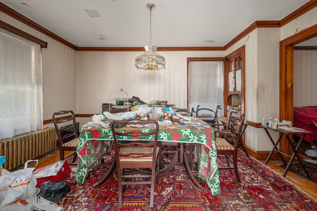 73 Woodard Road Boston, MA 02132 - Photo 4 of 20 a view of a dining room with furniture window and wooden floor