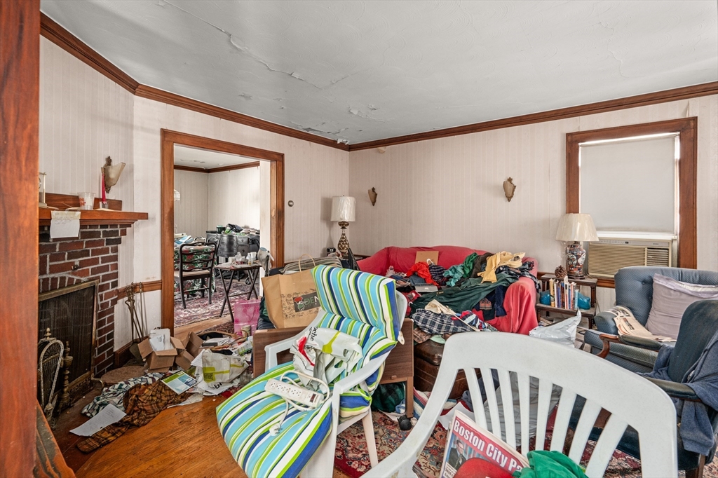 73 Woodard Road Boston, MA 02132 - Photo 6 of 20 a view of a livingroom with furniture and toys