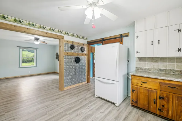 a bathroom with a sink a mirror and a shower