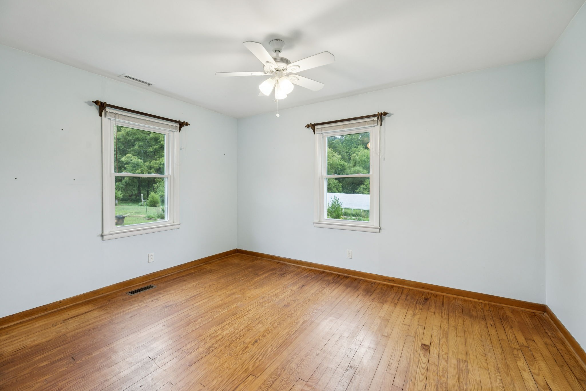 994 Bull Run Road Lynchburg, TN 37352 - Photo 29 of 76 a view of an empty room with wooden floor and a window