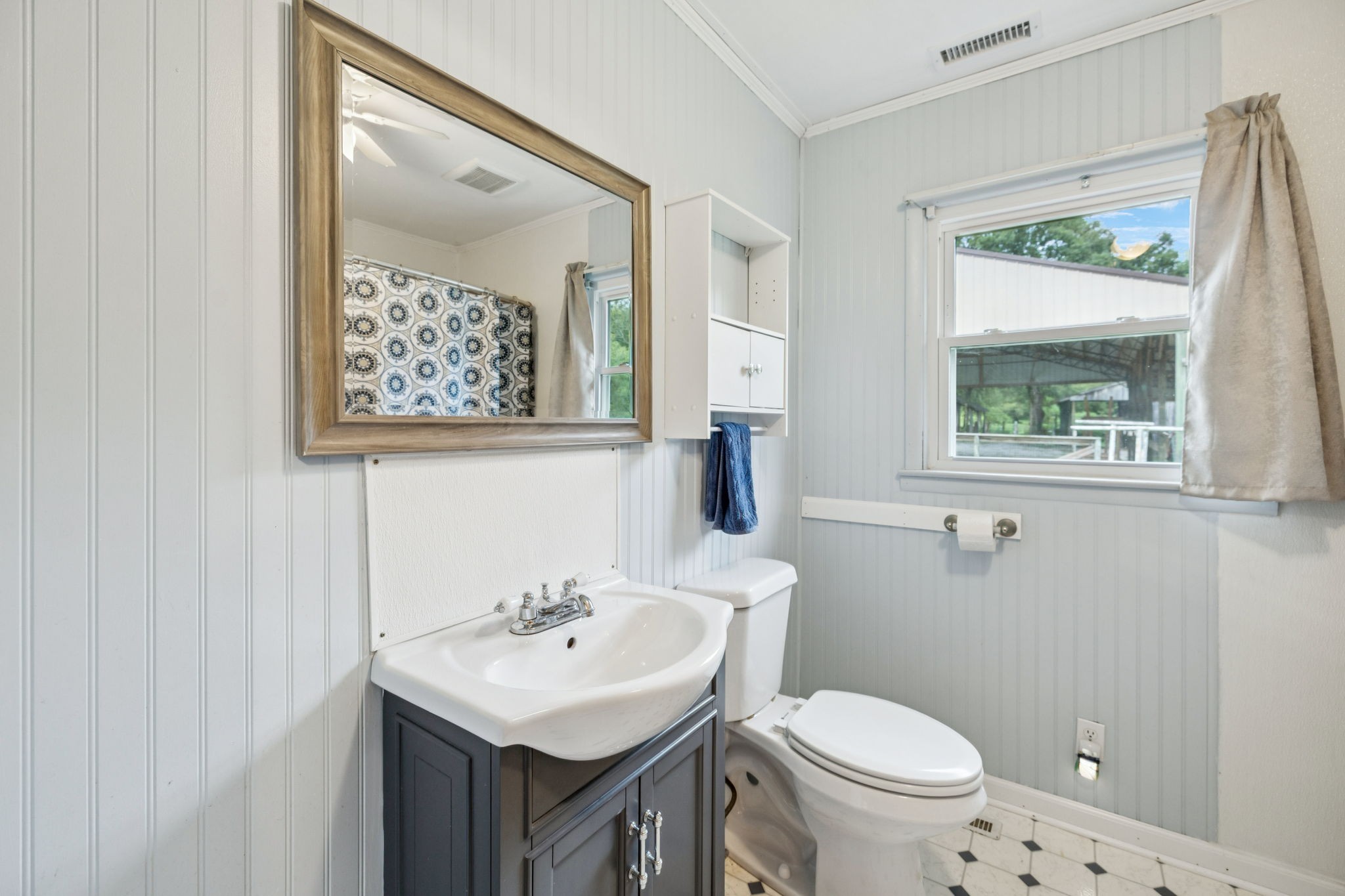 994 Bull Run Road Lynchburg, TN 37352 - Photo 33 of 76 a bathroom with a toilet sink and mirror