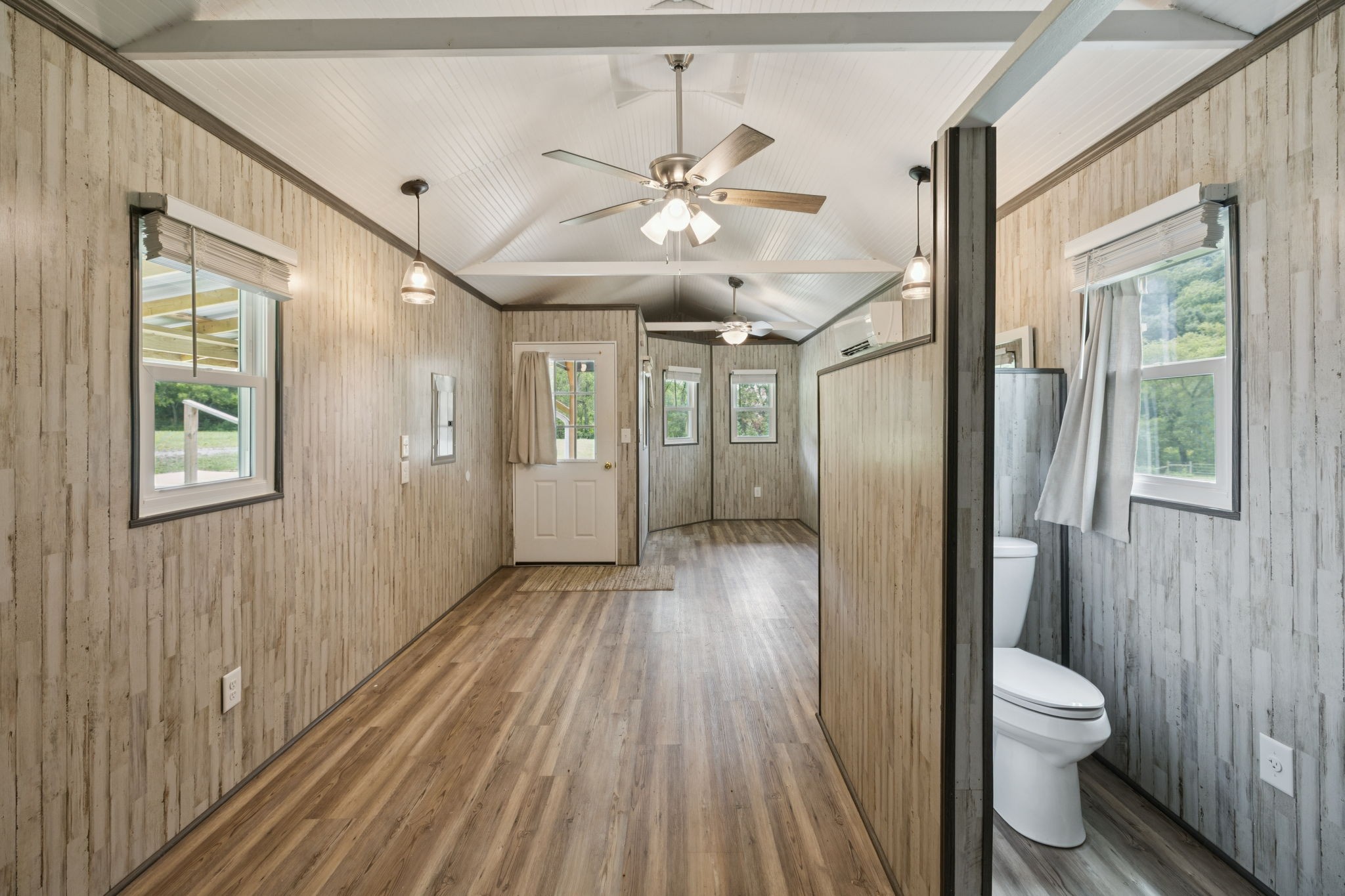 994 Bull Run Road Lynchburg, TN 37352 - Photo 39 of 76 a bathroom with a sink and a large mirror