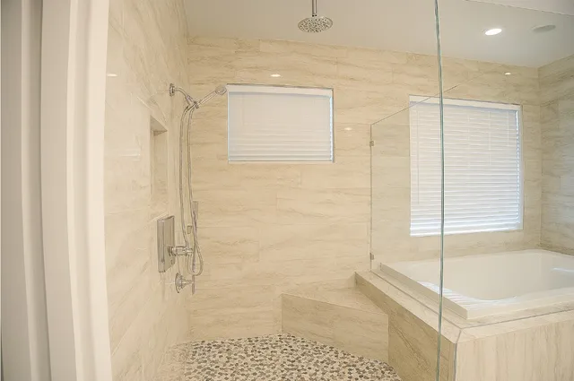 a view of a bedroom with furniture and a window