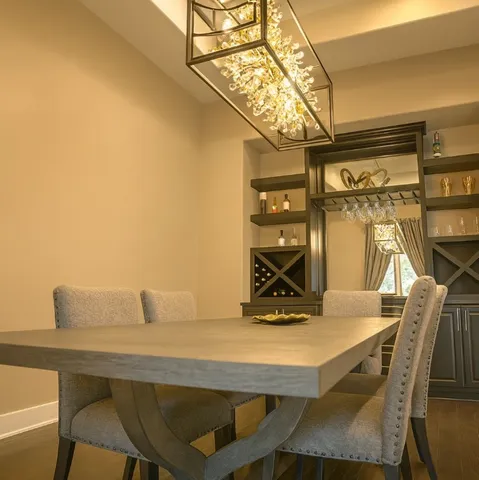 a spacious bedroom with a bed and a chandelier