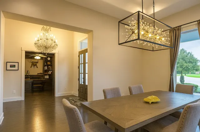 a view of a dining room with furniture and window