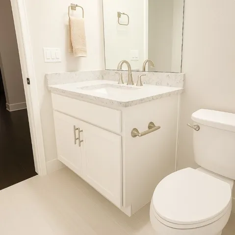 a view of a workspace with furniture and wooden floor