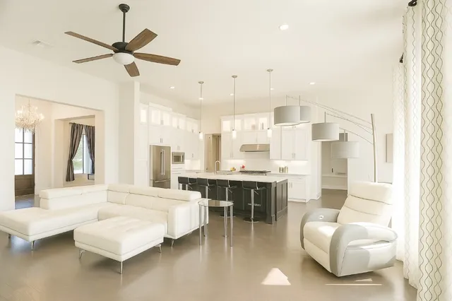 a living room with furniture and a large window