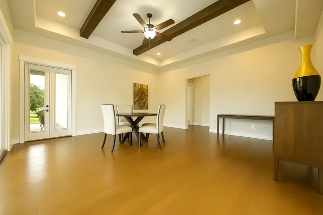 a living room with stainless steel appliances kitchen island granite countertop furniture and a fireplace