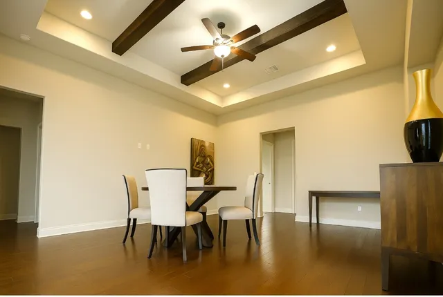 a view of kitchen with furniture and a ceiling fan