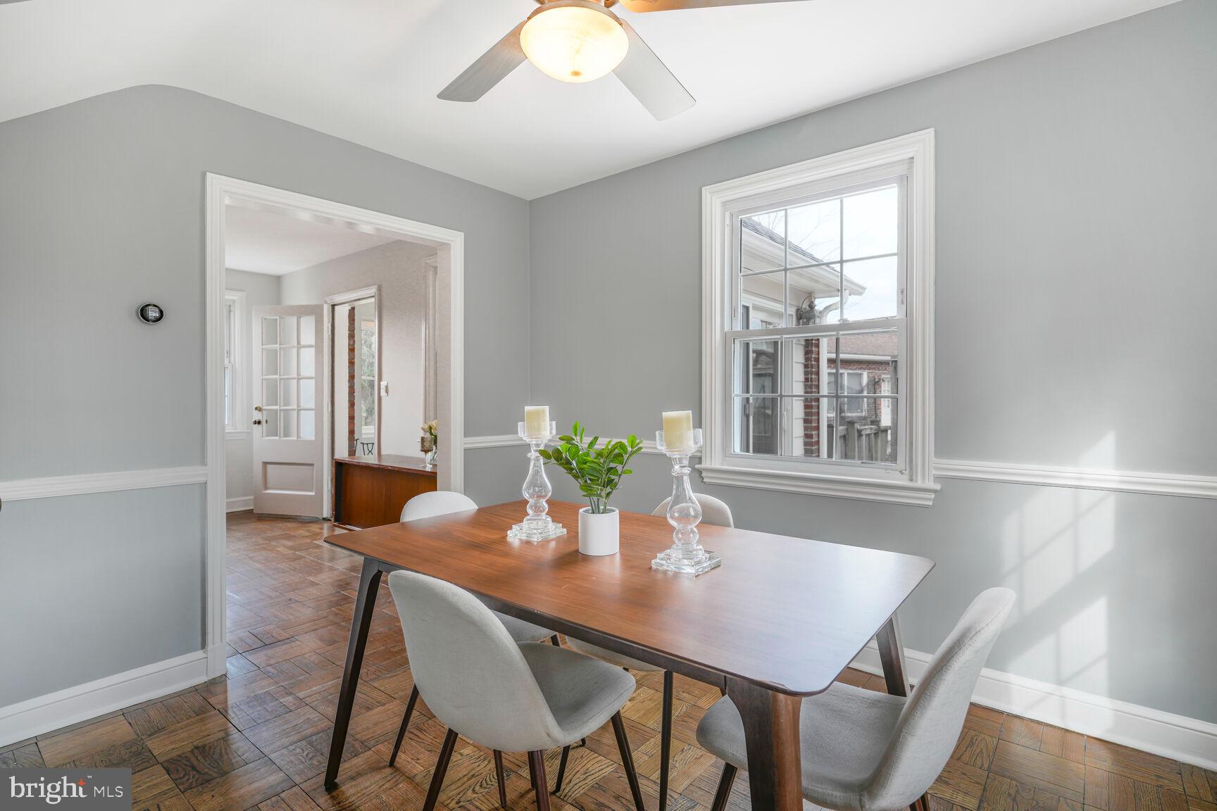 9213 Bradford Road Silver Spring, MD 20901 - Photo 12 of 34 a view of a dining room with furniture window and wooden floor