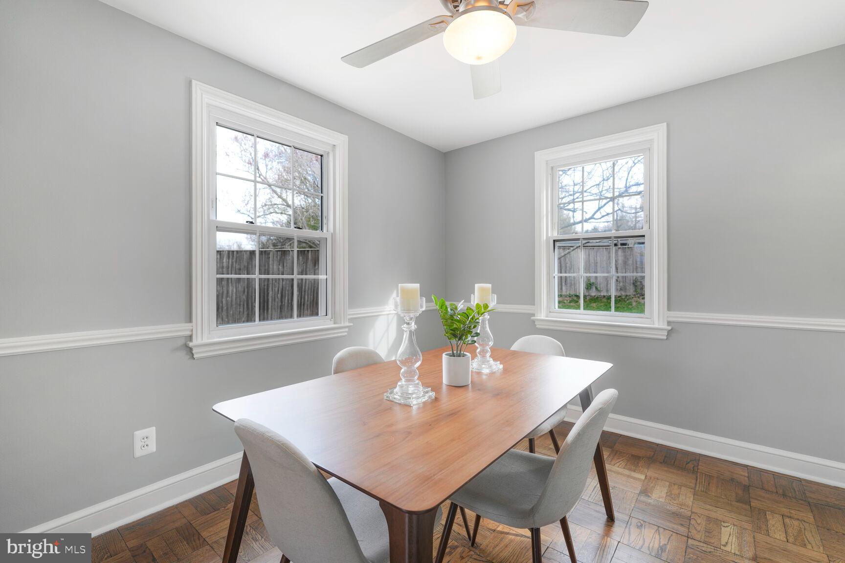 9213 Bradford Road Silver Spring, MD 20901 - Photo 13 of 34 a view of a dining room with a table and chairs