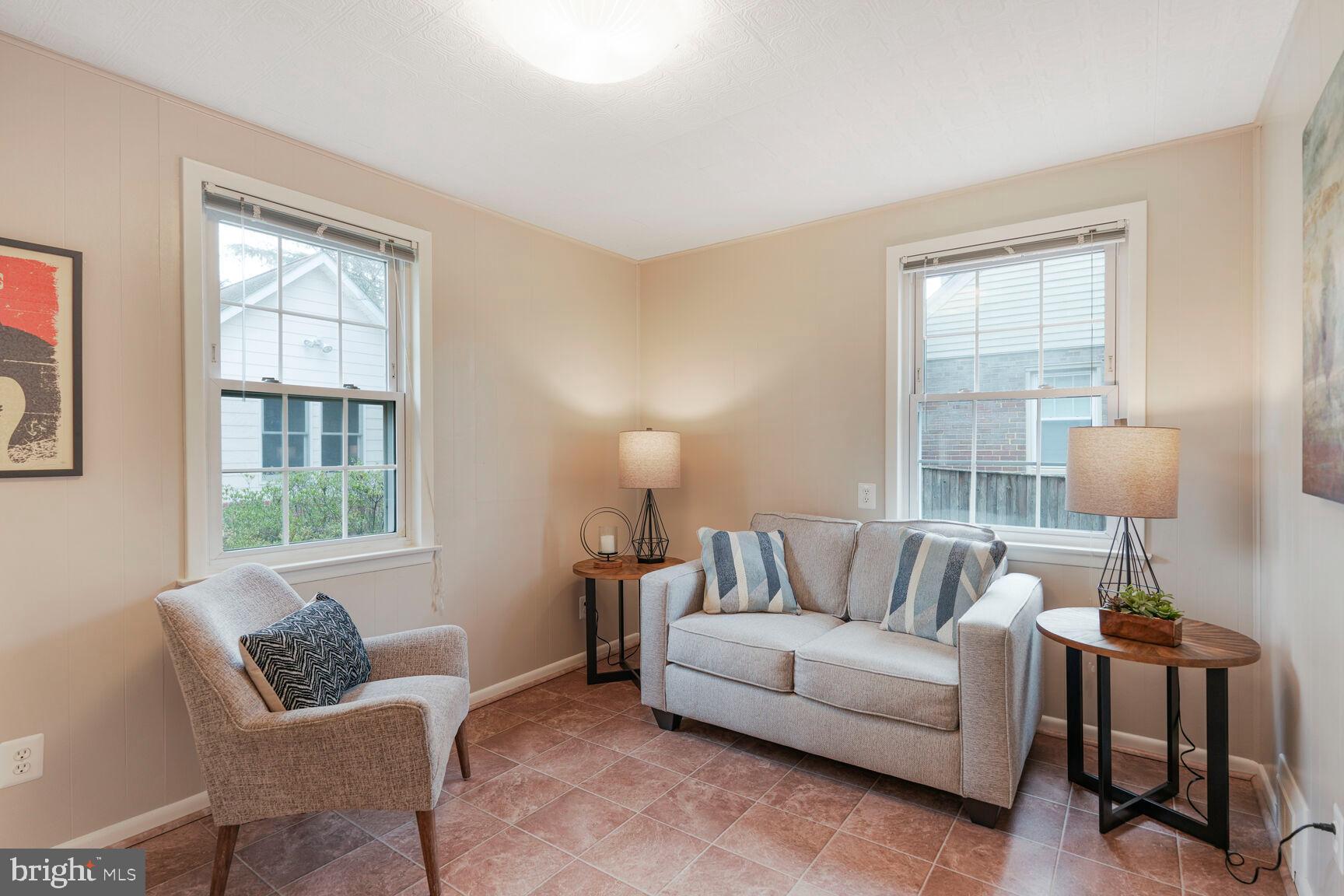 9213 Bradford Road Silver Spring, MD 20901 - Photo 16 of 34 a living room with furniture and a window