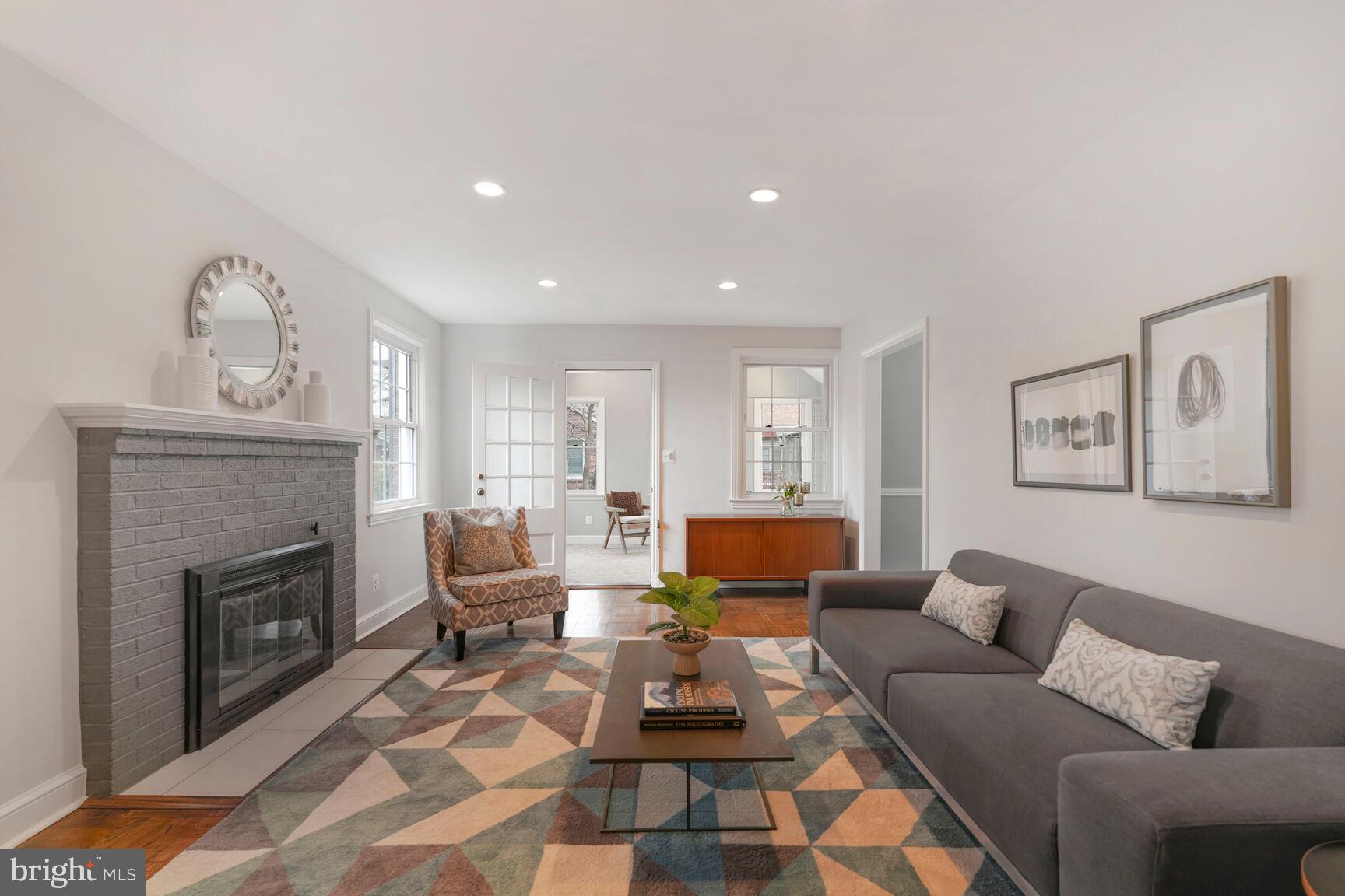 9213 Bradford Road Silver Spring, MD 20901 - Photo 17 of 34 a living room with furniture and a fireplace