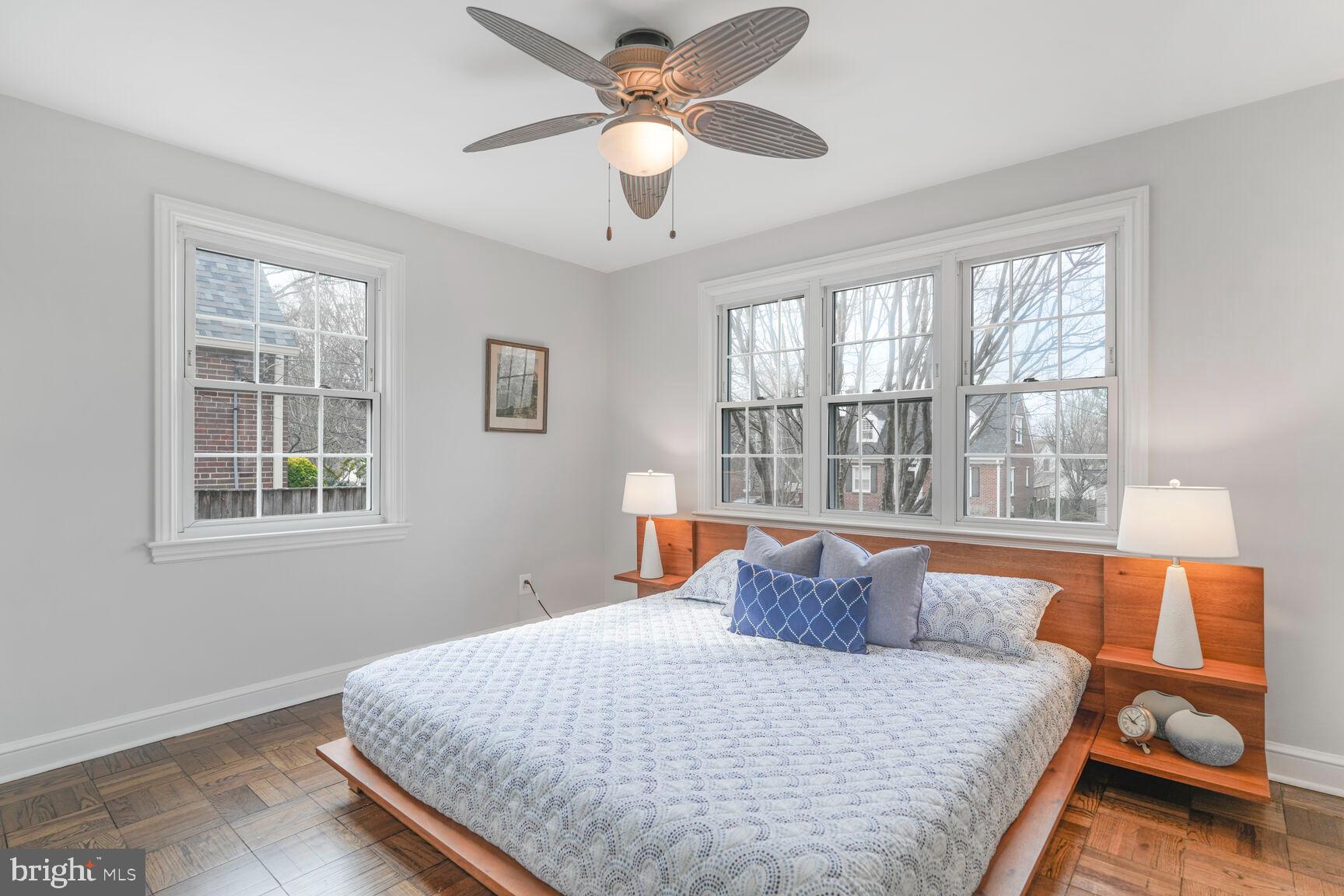 9213 Bradford Road Silver Spring, MD 20901 - Photo 19 of 34 a bed sitting in a bedroom next to a window