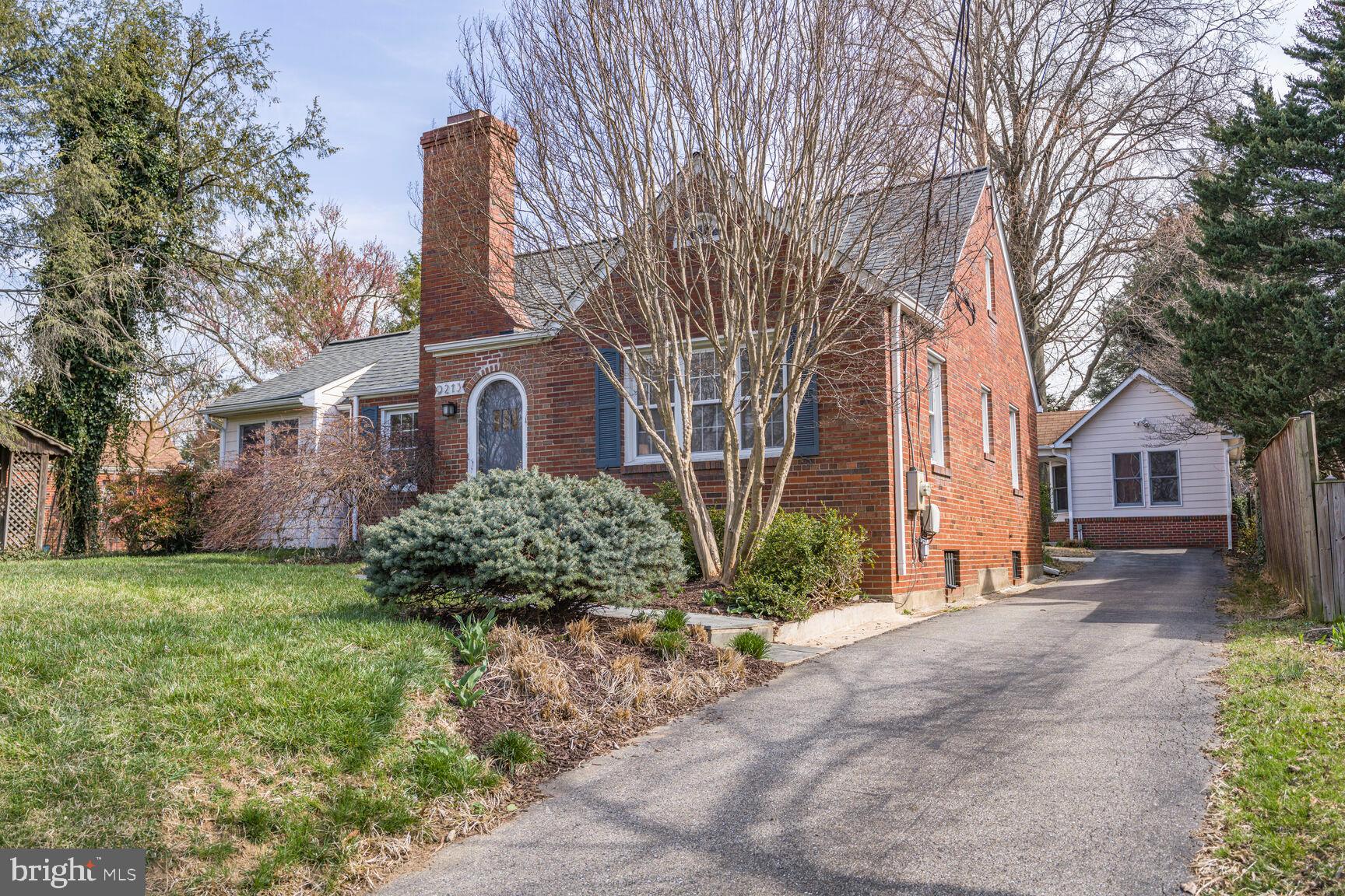 9213 Bradford Road Silver Spring, MD 20901 - Photo 2 of 34 a house that has a tree in front of it
