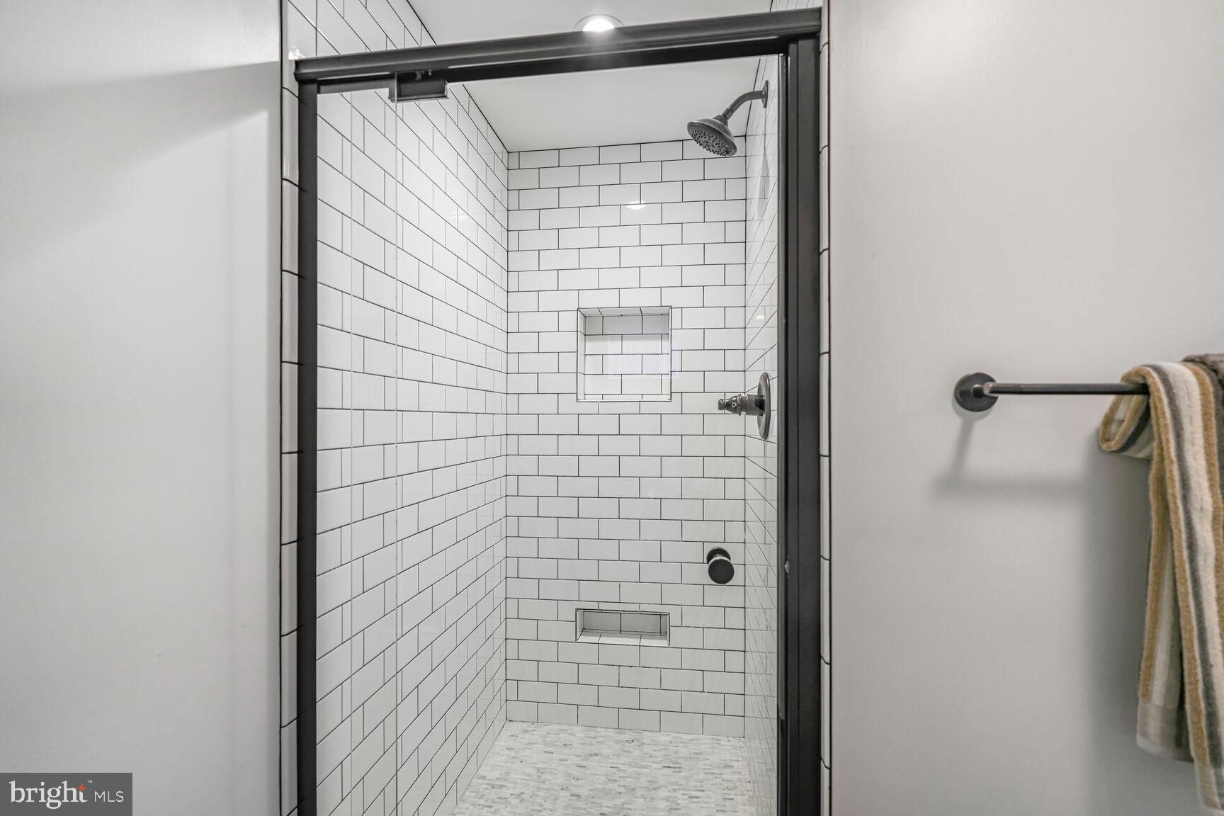 9213 Bradford Road Silver Spring, MD 20901 - Photo 29 of 34 a bathroom with a shower