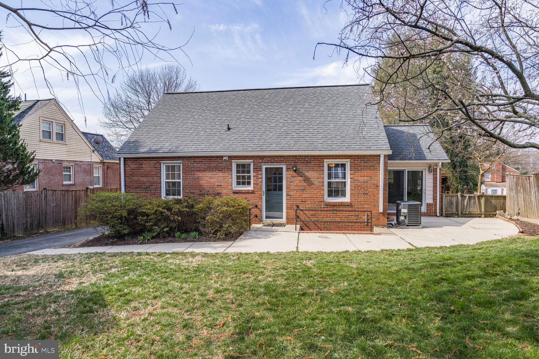 9213 Bradford Road Silver Spring, MD 20901 - Photo 32 of 34 a front view of house with yard and outdoor seating