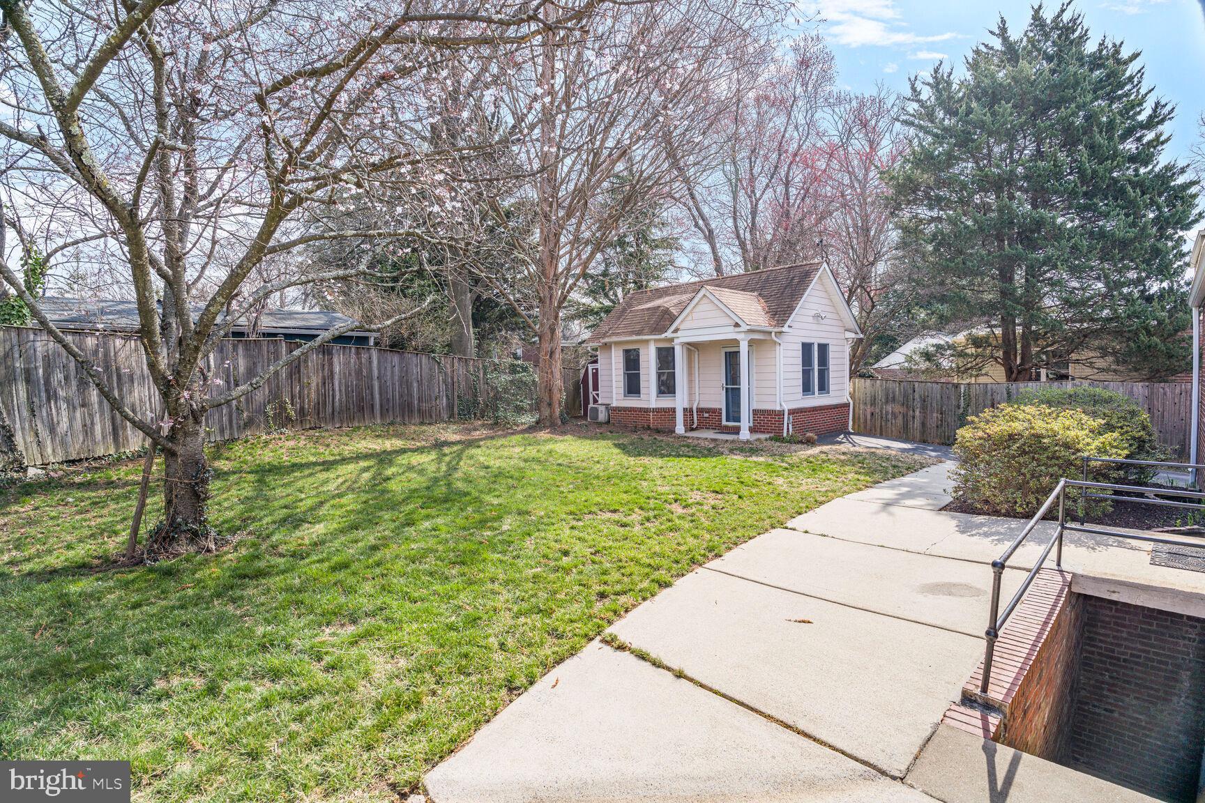 9213 Bradford Road Silver Spring, MD 20901 - Photo 33 of 34 a front view of a house with garden