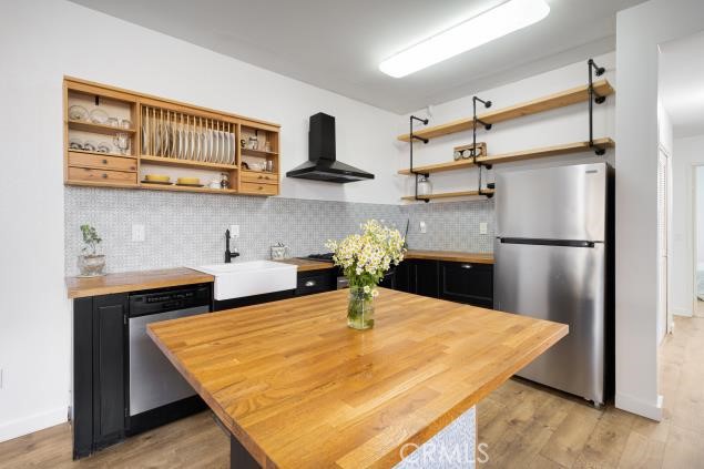 624 Corte Patio, Unit 81 Chula Vista, CA 91914 - Photo 12 of 35 a kitchen with stainless steel appliances granite countertop a refrigerator a sink and white cabinets